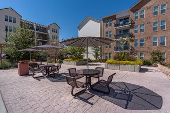 Outdoor patio with umbrellas, tables and chairs